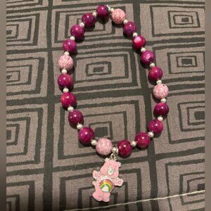 Elastic beaded bracelet with care bear charm